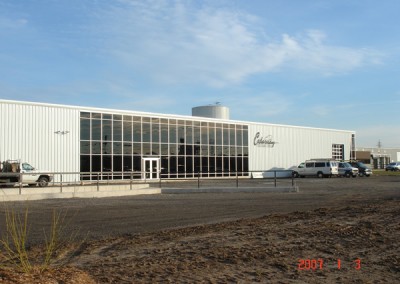 renovated commercial metal building with glass wall